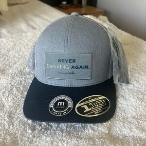 Travis Mathew’s Gray and Black Trucker Hat
